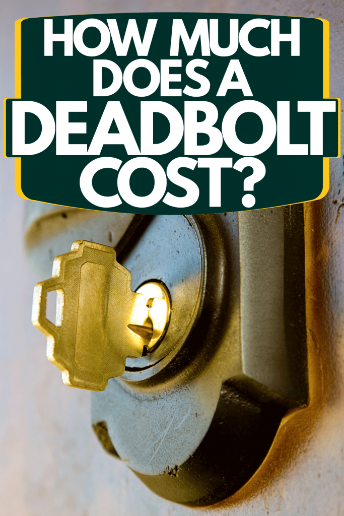 A golden key inserted on the deadbolt lock of a front door, How Much Does A Deadbolt Cost?
