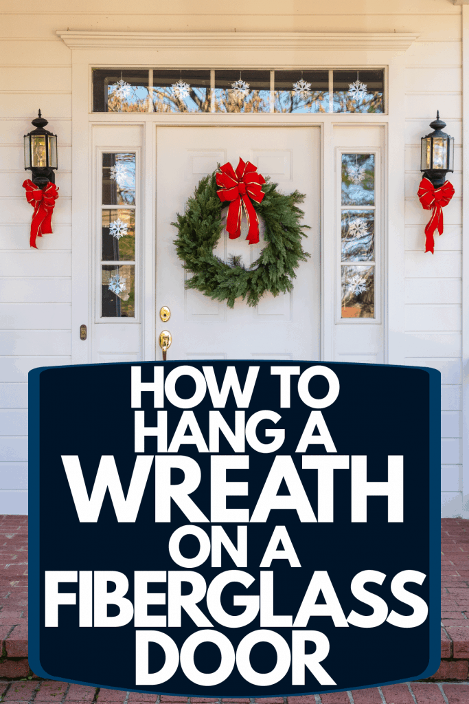 A fiberglass door with a white painted door with a green Christmas wreath, How To Hang A Wreath On A Fiberglass Door