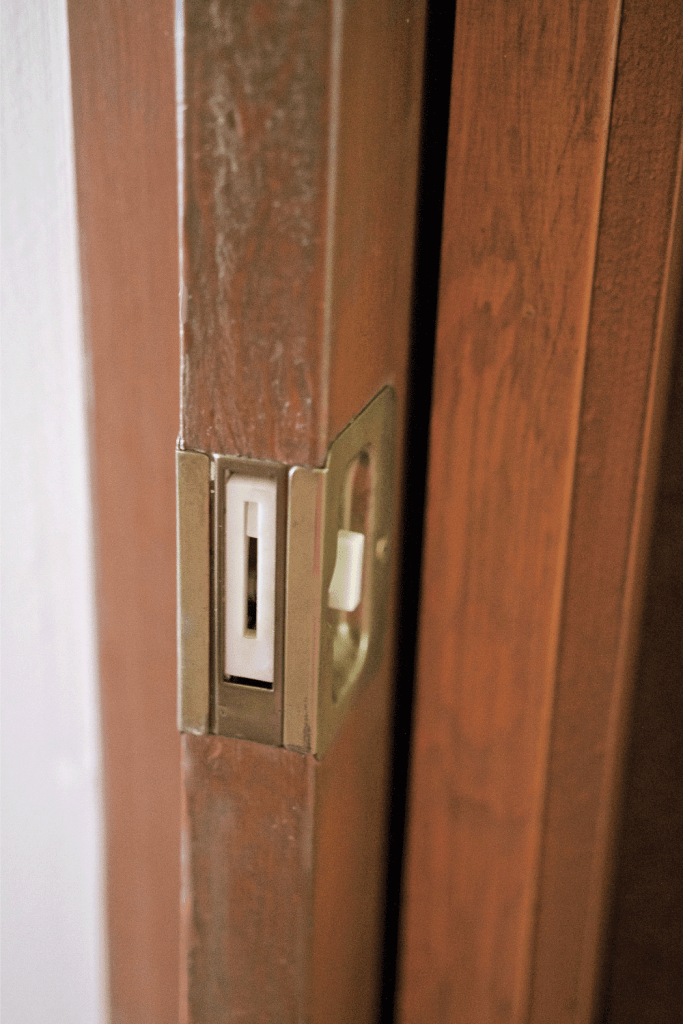 Wooden pocket door, close up on door locking mechanism