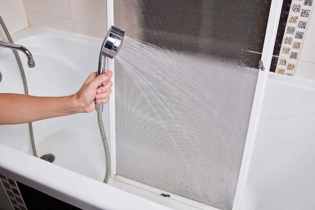Cleaning and washing dusty mosquito net screen door