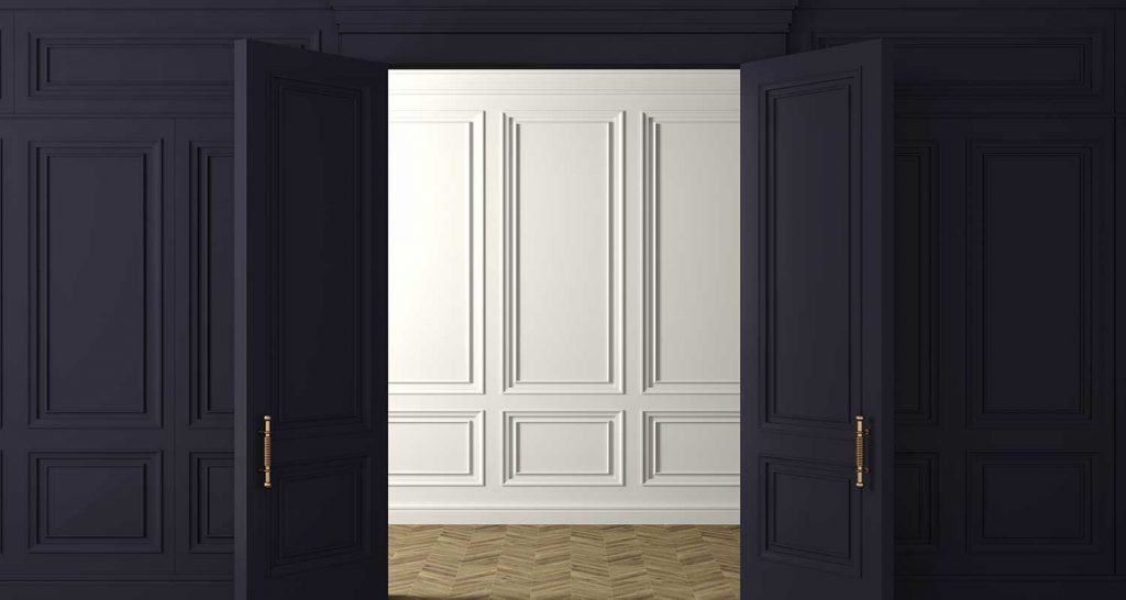 Classic wall of dark wood panels doors