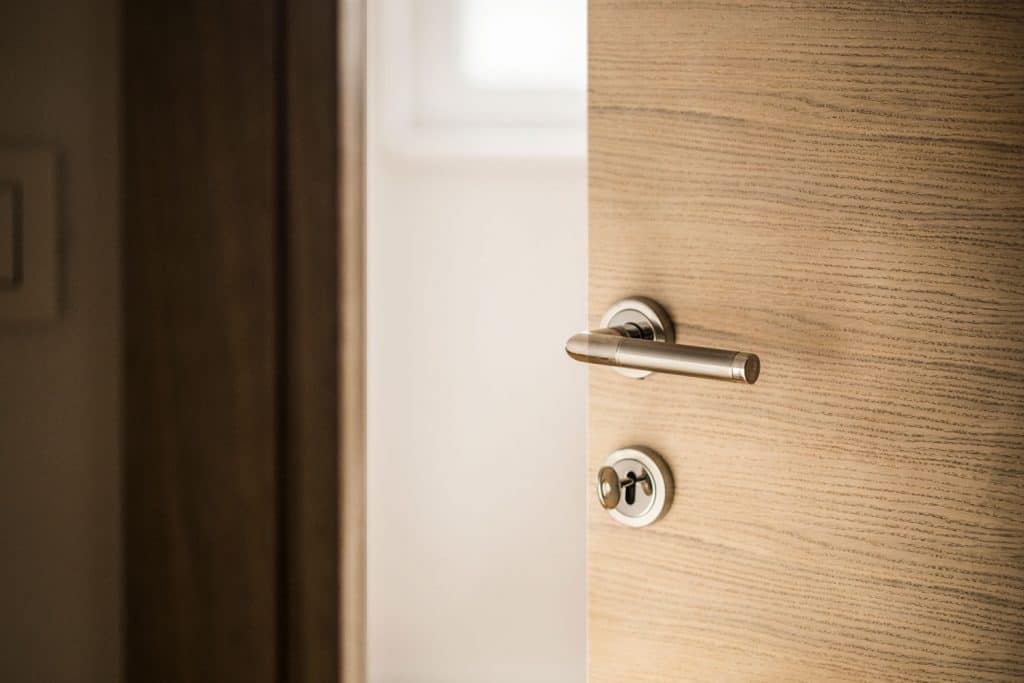 A brass minimalist inspired door handle in the door handle