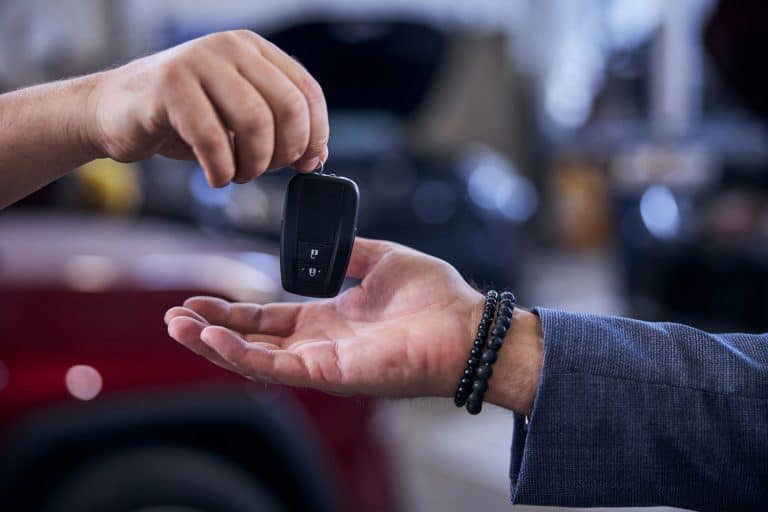 A car dealer handing the keys to the owner of a car, Are Transponder Keys Waterproof?