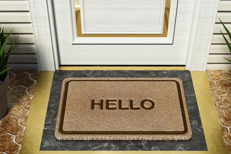 Doormat with HELLO word standing in front of the house door, How Big Should A Doormat Be?