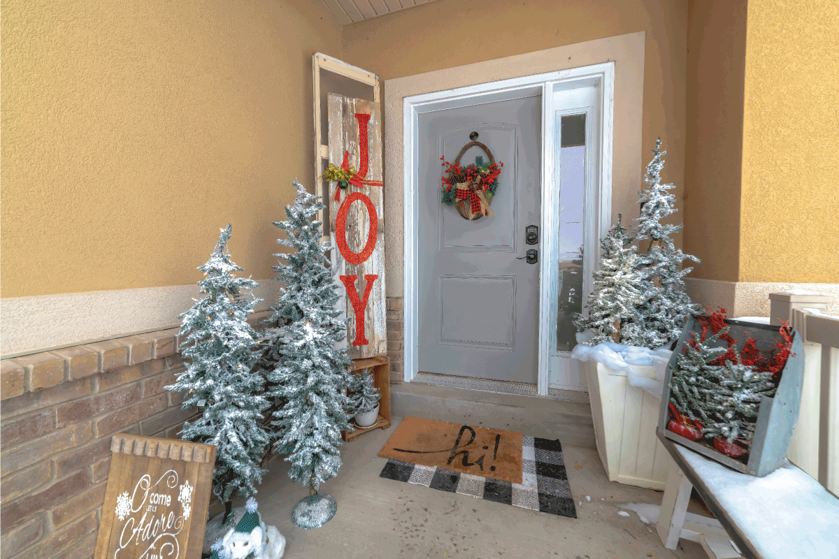 Festive home entrance with christmas trees holiday decorations and basket wreath. Can You Put A Screen Door On The Inside