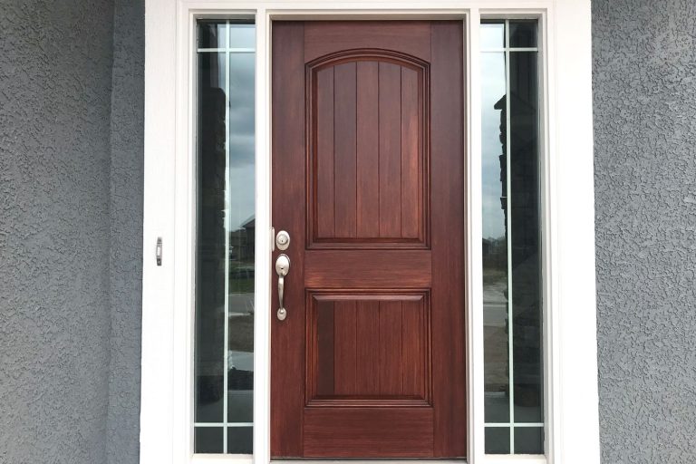 A brown front door with huge window panes and white door frames, What Is The Strike Side Of The Door?
