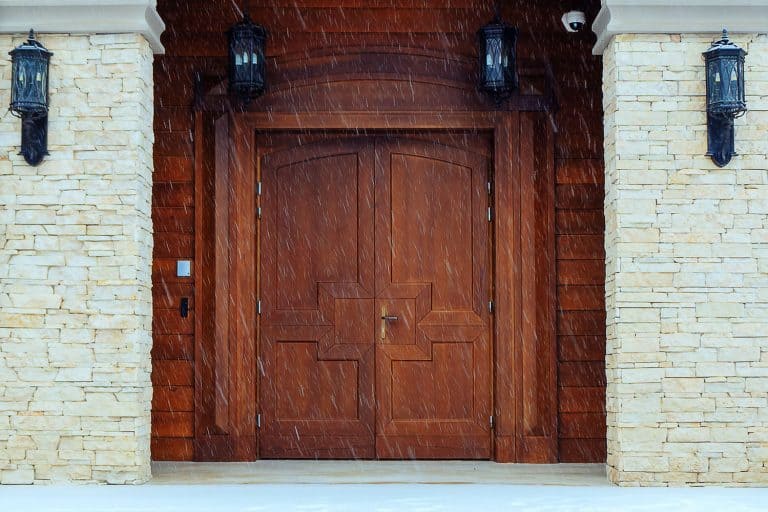A huge French front door of a building, Do Storm Doors Keep Water And Cold Air Out?