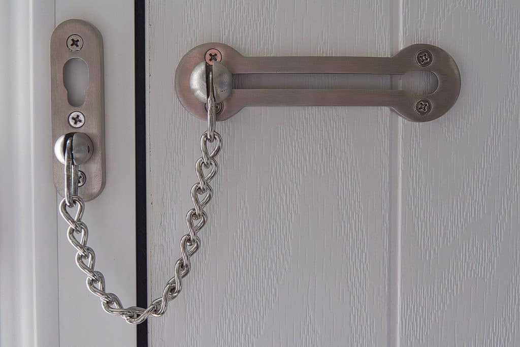 A stainless steel chain lock in the front door