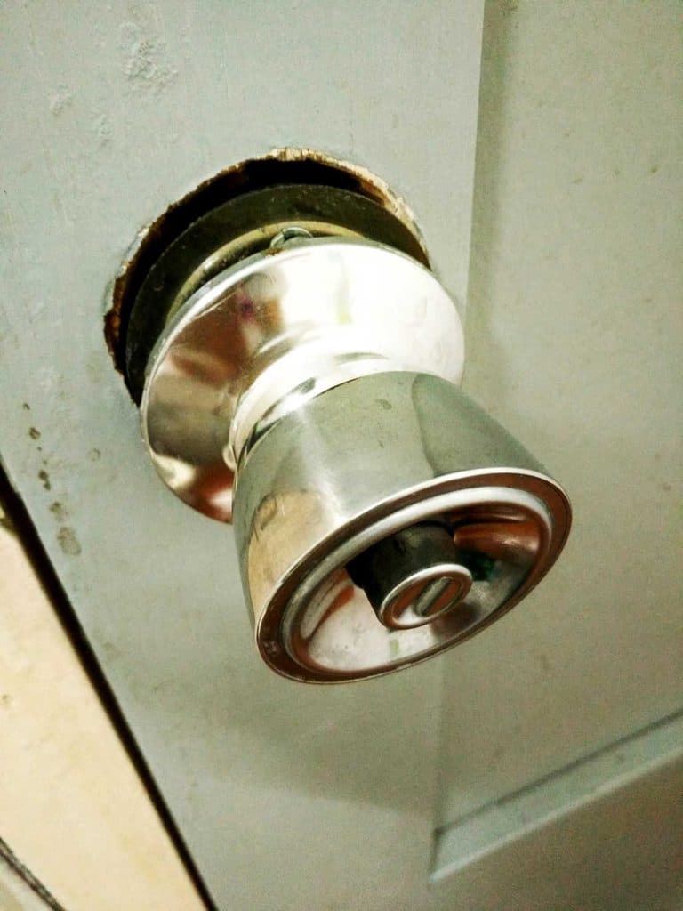 Broken and old metallic doorknob