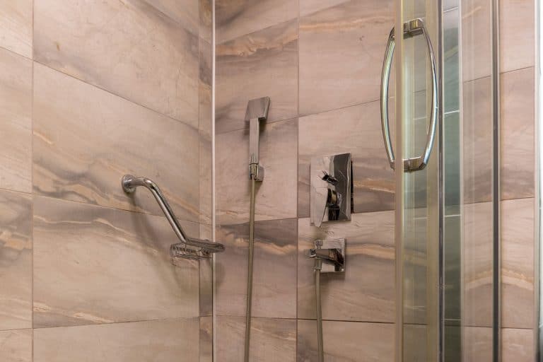 Closeup view op modern shower cabin with metal objects, How To Tighten A Glass Shower Door Handle [Plus Handle Replacement Tips!]