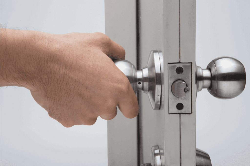 Hand holding a door knob