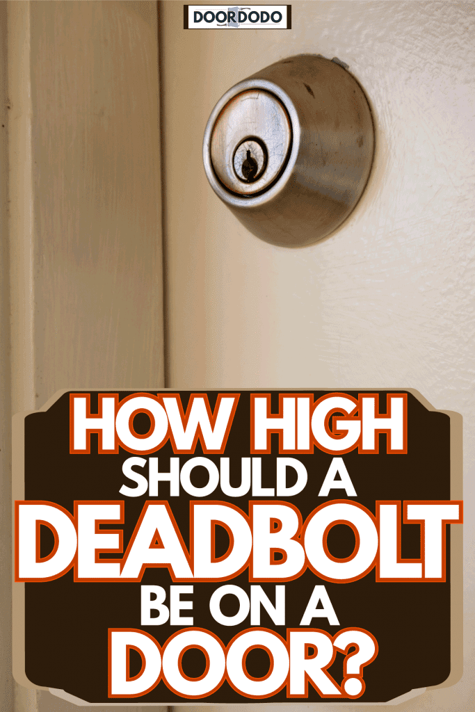 A white wooden front door with a stainless steel door with a deadbolt lock, How High Should A Deadbolt Be On A Door?
