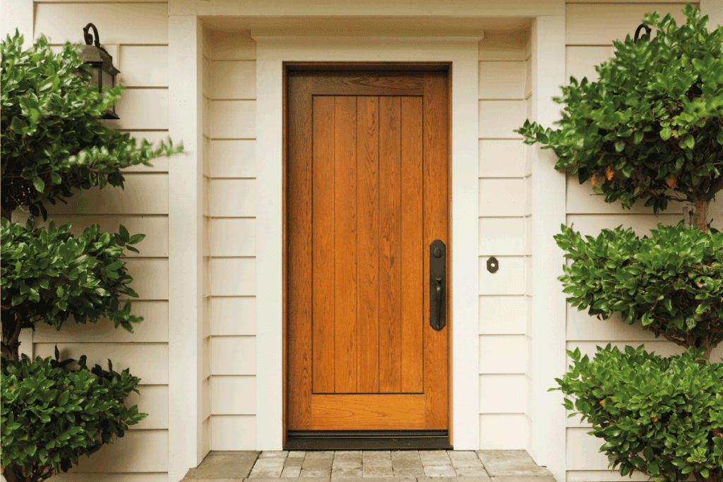 beautiful wooden Front door and stoop. perfectly installed. Door Not Closing Flush—What To Do