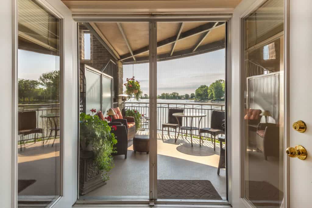 A brown framed sliding door leading to the patio