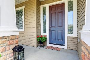 A front entry door with concrete floor porch and flowers pot, How Wide Is A 6-Panel Door?