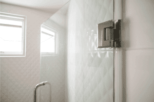 Door hinges on glass door in bathroom for wet zone. Shower Door Leaks At Hinge - What To Do?