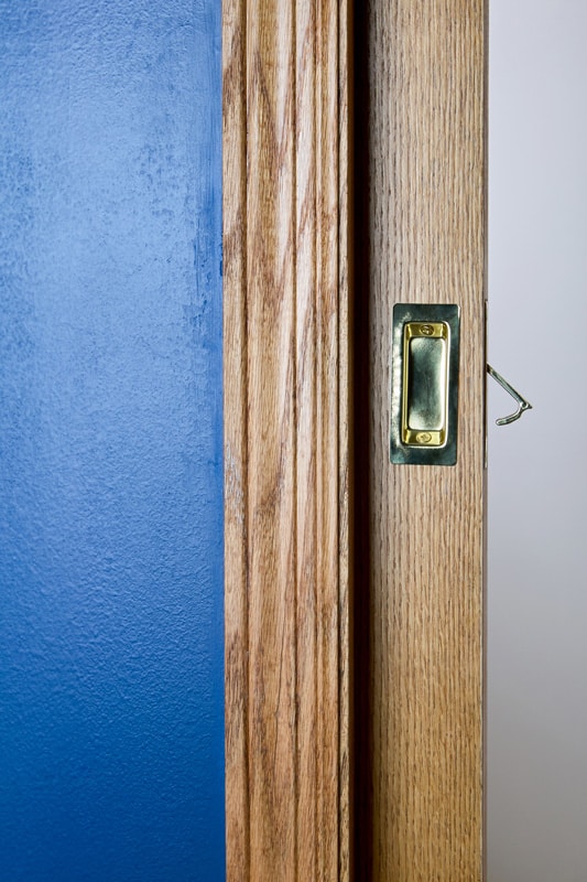 Wooden concealed pocket door
