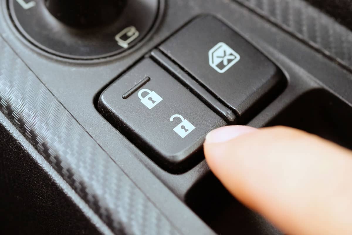 hand push the car lock button